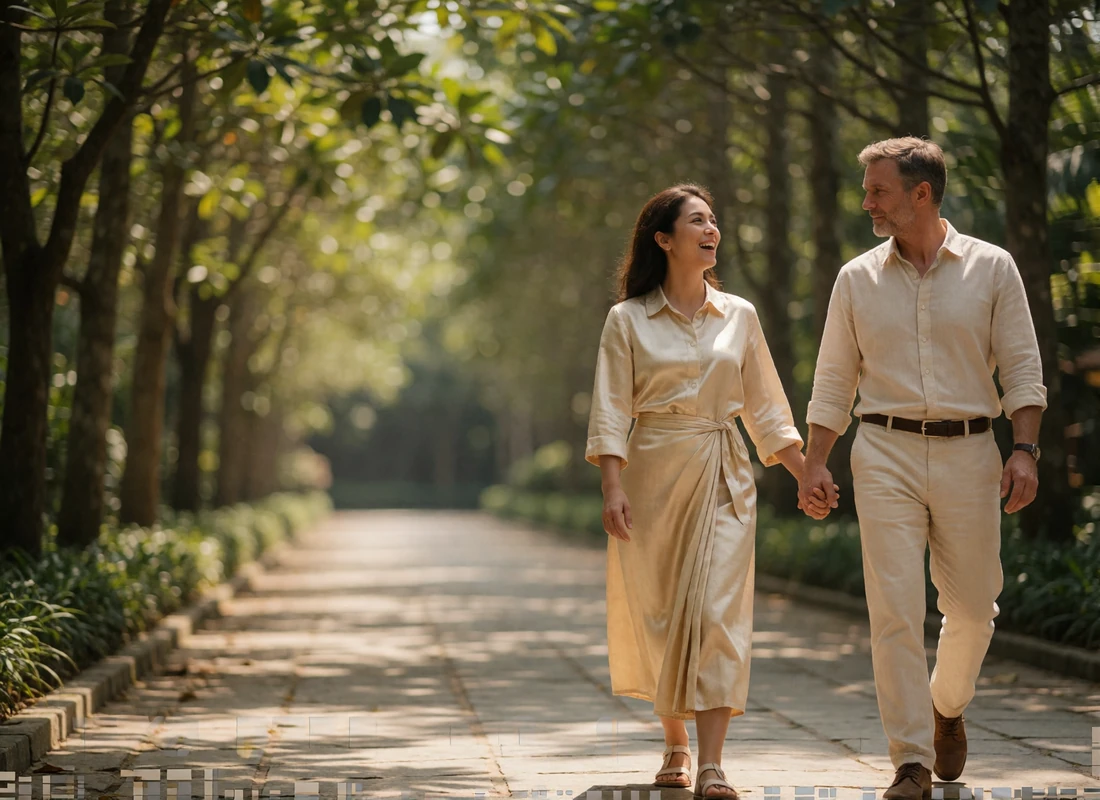 Cambodian woman and a Western man walking hand in hand along a shaded stone pathway near ancient ruins